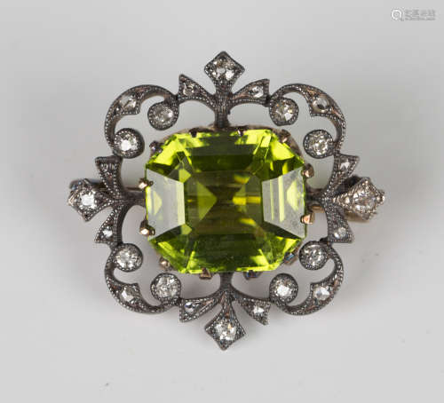 A late Victorian gold backed and silver set peridot and diam...