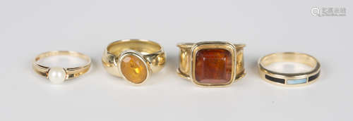 A gold ring, mounted with a cushion cut amber, detailed '14K...