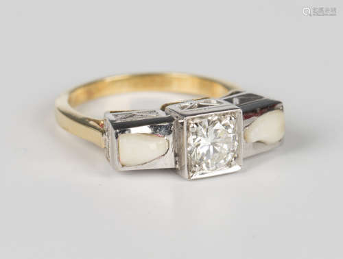 A diamond ring, mounted with a circular cut diamond between ...