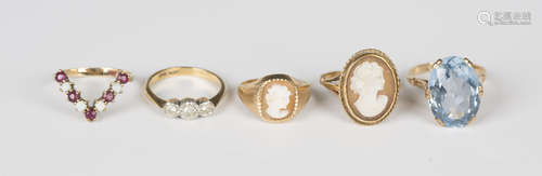 A gold and platinum ring, mounted with a row of three circul...