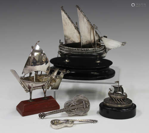 A Maltese .917 silver model of a Gozo sailing boat, on an eb...