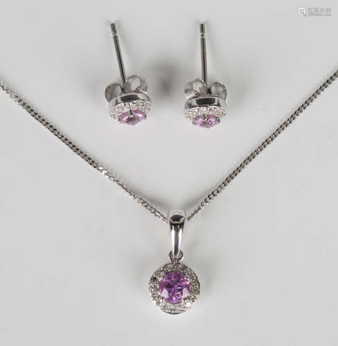 A white gold, pink sapphire and diamond cluster pendant, det...