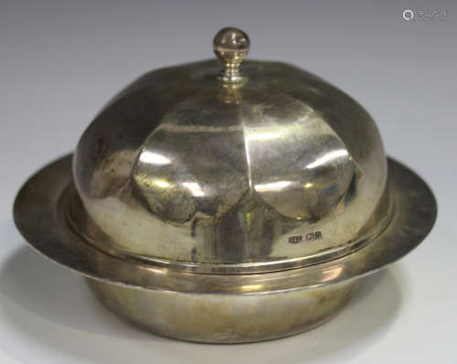 A George V silver muffin dish, liner and domed cover with oc...