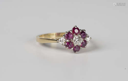 An 18ct gold, diamond and ruby cluster ring, claw set with t...