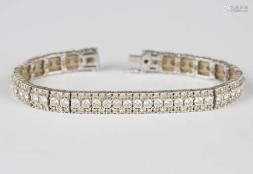 An 18ct white gold and diamond bracelet, designed as a row o...