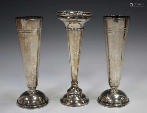 A pair of Elizabeth II silver specimen vases, each on a dome...