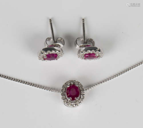 A white gold, ruby and diamond cluster pendant, detailed '37...