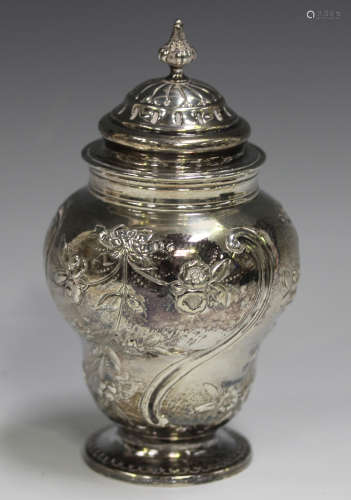 A Victorian silver tea caddy of ogee baluster form with dome...