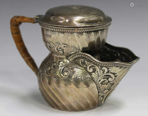 An Edwardian silver shaving mug, the spiral fluted body deco...