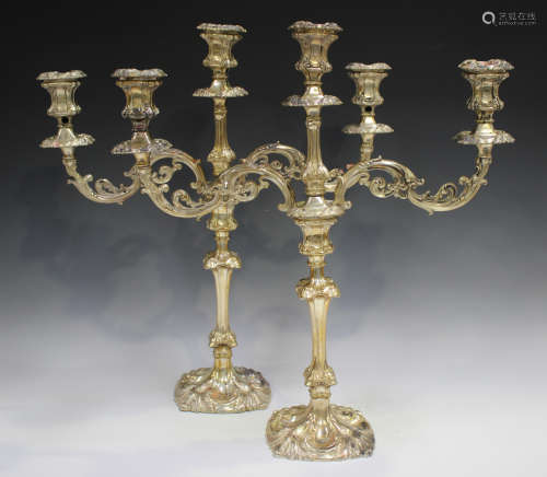 A pair of Edwardian silver twin-branch three-light candelabr...