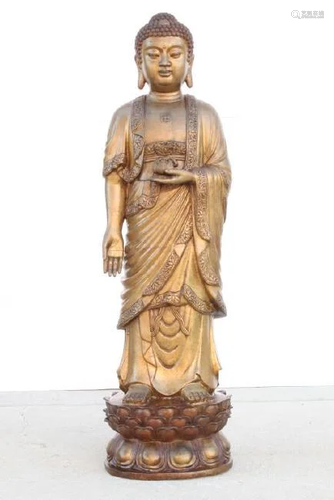 CARVED STATUE OF A STANDING BUDDHA