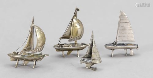 Four miniature sailboats, a.o.