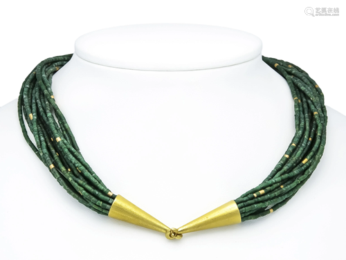 Emerald necklace with designer