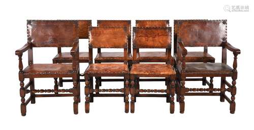 A set of eight oak and brass studded brown leather upholster...