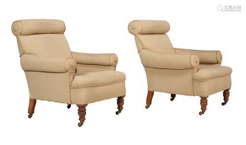 A pair of late Victorian oak and upholstered armchairs