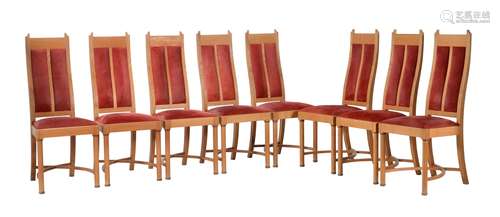 A set of eight walnut and suede style upholstered dining cha...