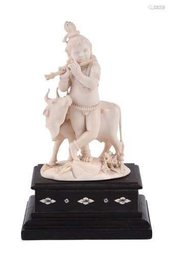 Y An Indian carved ivory figure of the infant Krishna playin...