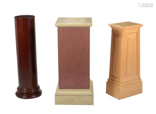 A group of three various display pedestals