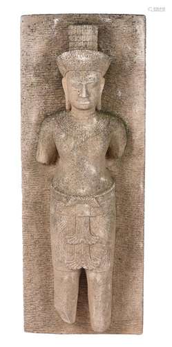 A Khmer style sandstone relief panel depicting a male deity