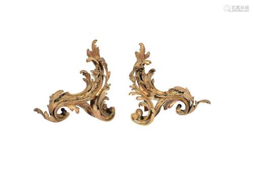 A pair of French gilt bronze chenets in Louis XV style