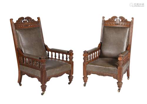 A pair of Victorian carved oak and upholstered armchairs