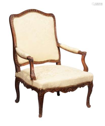 A French beech and upholstered armchair in Louis XV style