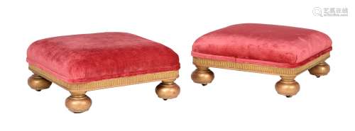 A pair of Victorian giltwood and upholstered footstools