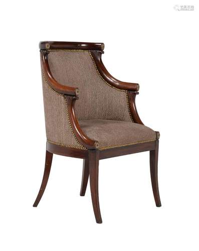 A Louis Philippe mahogany and upholstered bergere armchair