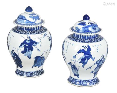 A pair of large Chinese blue and white jars and covers