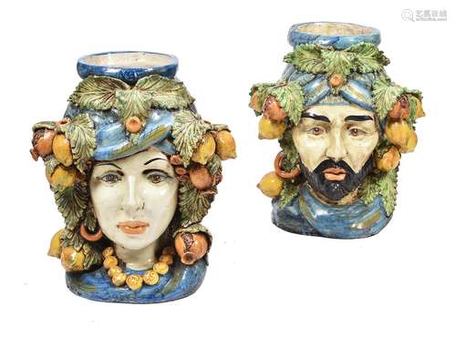 A pair of modern Sicilian Maiolica style figural head jars o...