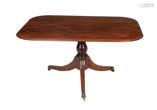 A mahogany pedestal dining or breakfast table