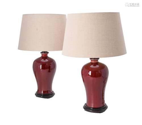 A pair of red glazed table lamps in Chinese style