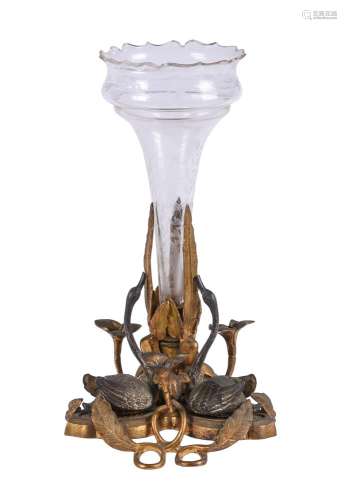 A patinated and gilt bronze, glass mounted centrepiece