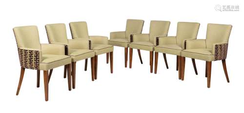 A set of fourteen beech and upholstered armchairs
