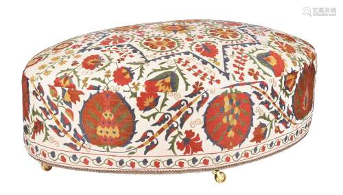An oval Susani upholstered centre stool