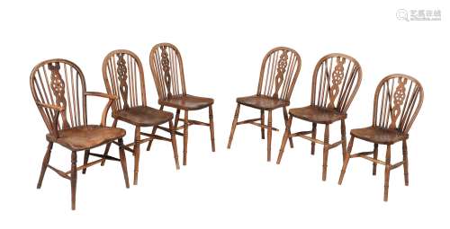 A set of six ash and elm wheel back Windsor chairs