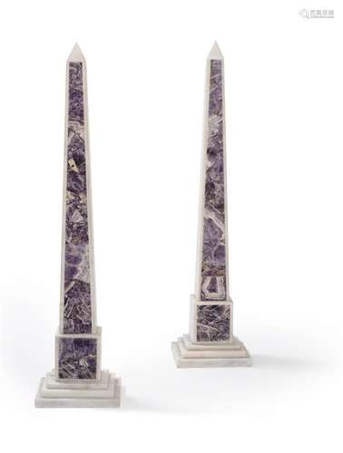 A pair of amethyst marble inlaid obelisks