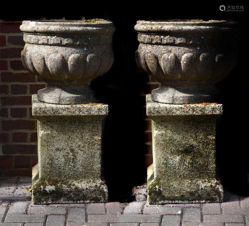 A pair of stone composition vases