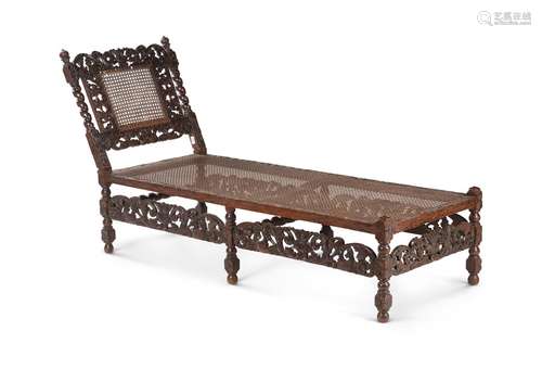 A carved oak day bed in Charles II style