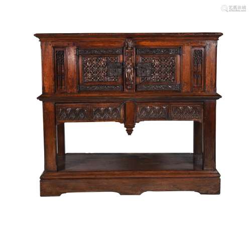 A carved oak hall cupboard