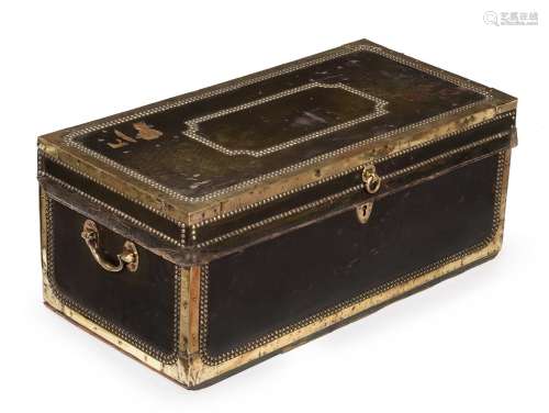 A studded leather and brass bound trunk