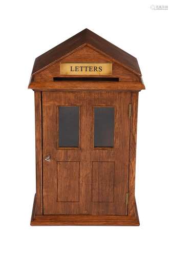 An oak domestic letter box in late Victorian style