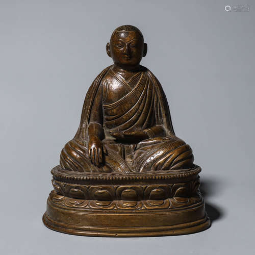 A copper buddha statue