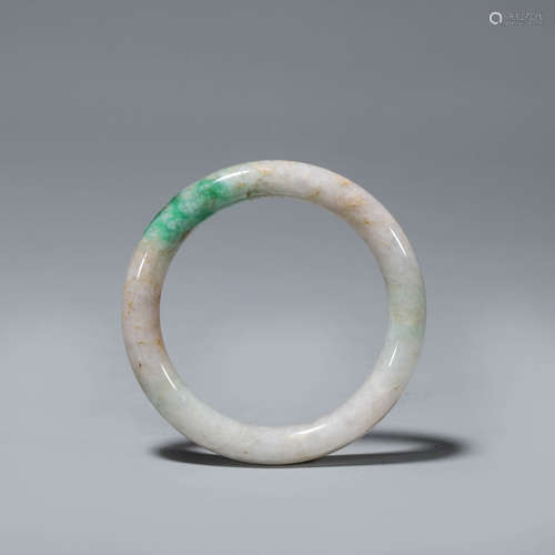 A green tinged jadeite bracelet