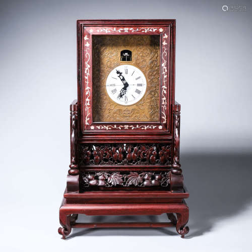 A rosewood raden-inlaid mechanical clock