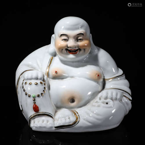 A porcelain Maitreya figurine