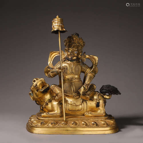 A gilding copper yellow Jambahla buddha statue