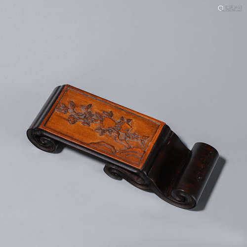 A peach patterned ebony brush stand