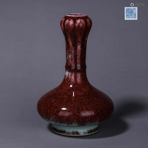 A red glazed porcelain vase