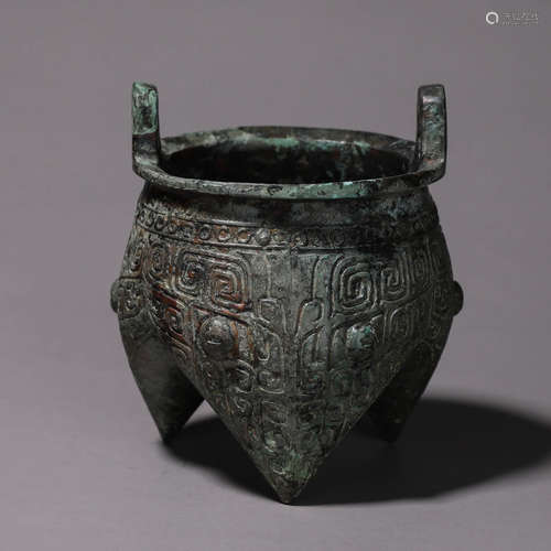 A taotie patterned three-legged bronze pot